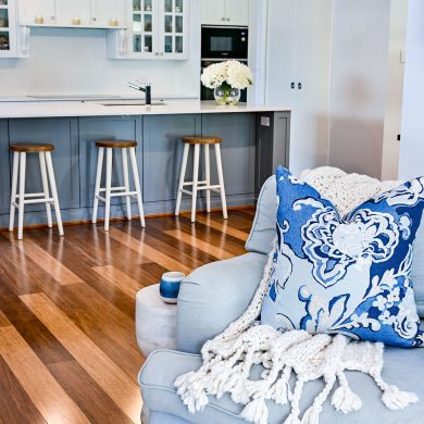 Hamptons Kitchen in Timeless Grey by Dulux, with pendant lighting, Provincial Home Living Occasional Chair with Meissen Ink Cushion and Throw from Bed Bath and Table, Verdura Timber Flooring from Australiana Style Group