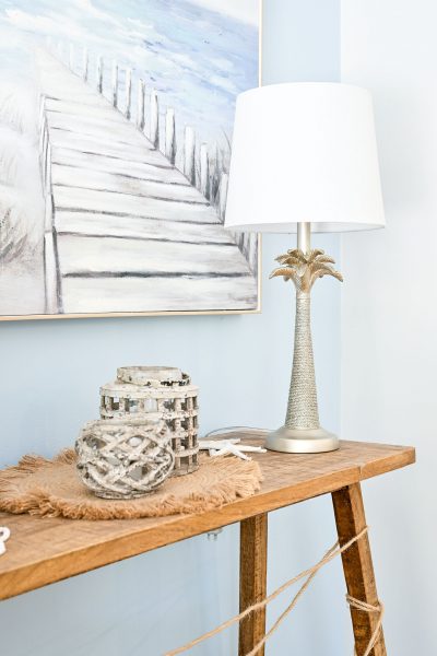 Lawson Console Table Natural from Provincial Home Living accessories from MotzDesigns Artwork from Hamptons Home Rexington Home Beverley Table Lamp from Temple & Webster Placemat from Pillow Talk