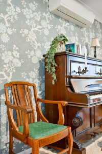 Thibaut's Claudette Wall Covering, Antique Dining Chair with original upholstery Antique Piano with Candle Holders Horse Head Bookends from Bed Bath & Table